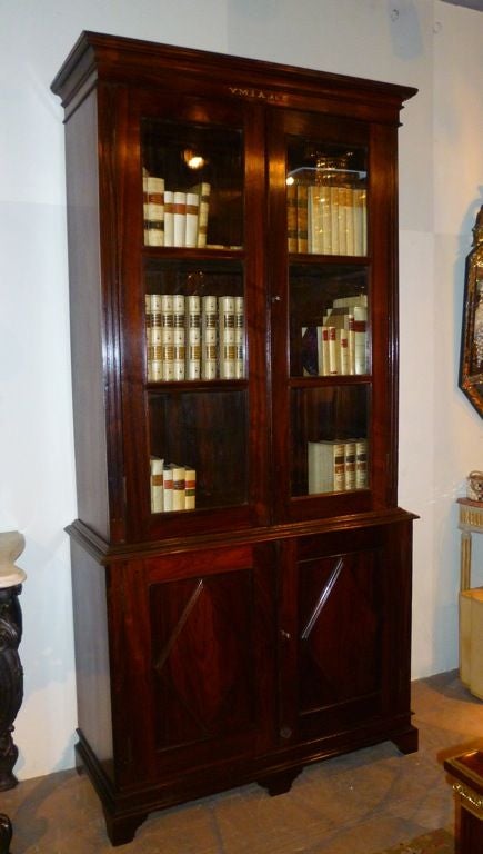 Pair of Anglo Indian Early 20th Century rosewood bookcases.<br />
Each Bearing the labels for YMIA, (Young Mens Indian Assc.) Madras. By repute from the library at Gokhale Hall in Chennai (formely known as Madras)  <br />
 <br />
Please Note: Any