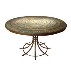 A Ceramic Top Table with Iron Wrought Base