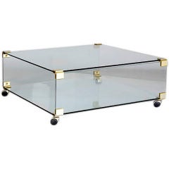Vintage Glass Coffee Table on Casters with Brass Corner Mounts, 1970s