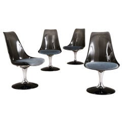 A Set of Four Smoked Lucite Tulip Swivel Chairs 1970s