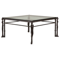 A Giacometti Style Iron Framed Coffee Table