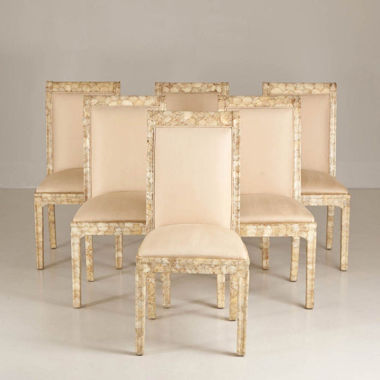 Set of six lacquered crushed oyster shell veneered dining chairs with rear sabre legs and scrolled detail to the tops, USA, 1980s.
 
 