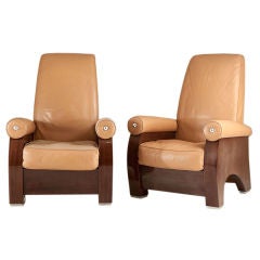 A Pair of Leather Upholstered Walnut Veneered Armchairs