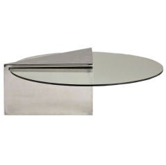 A Stainless Steel Wedge Shaped Cantilevered Coffee Table