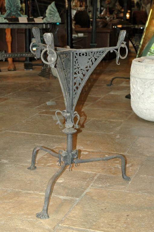 Unique hand forged iron table base. Incredible detailed & hand pierced construction, with ornamental details complete with mythological dragon heads and animal feet. Northern European, possibly 15-16th century, or earlier. The base measures 33