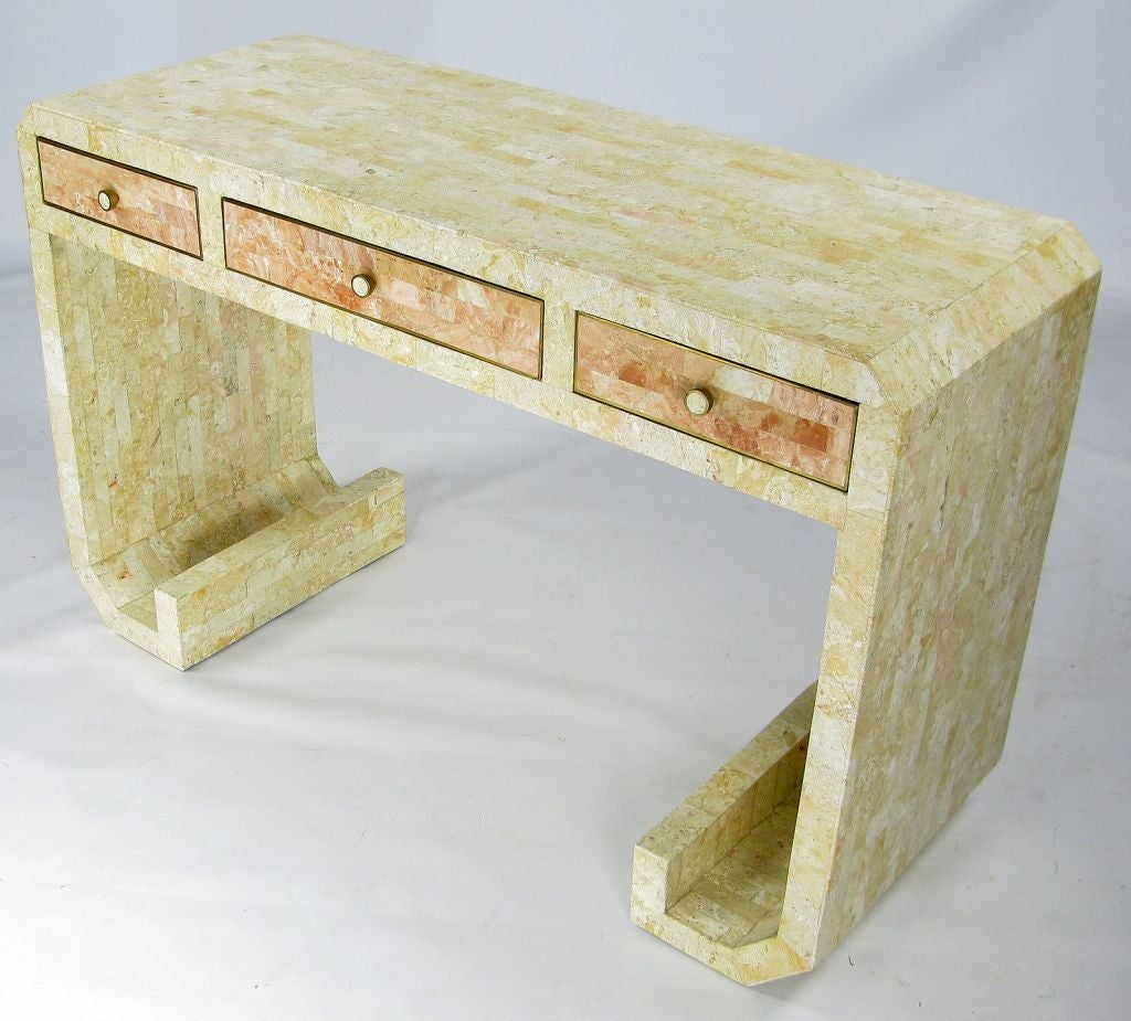 This fossil stone dressing table was designed by Robert Marcius and distributed by Casa Bique. Marcius designed pieces that were sold through the Karl Springer and Lorin Marsh showrooms. <br />
<br />
Asian inspired and made in the same genre as