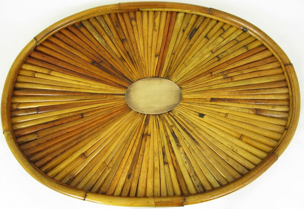 Bamboo star burst oval tray by Gabriella Crespi. The brass center oval medallion has been left untouched with it's original patina. Retains the original Nieman Marcus tag.  Original brass signature plate represented by the obvious ghost line where