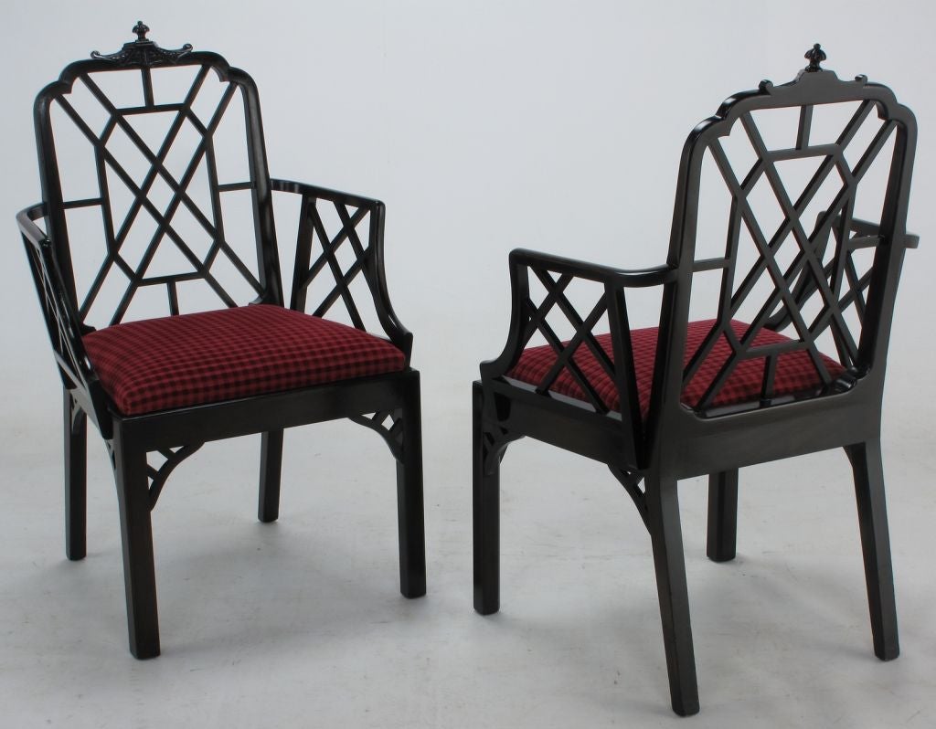 Excellent set of eight Chinese Chippendale dining chairs in ebonized mahogany and red cut velvet upholstered seats. The set features two arm chairs of slightly larger size and six side chairs.  All have a wonderfully carved pagoda style back finial