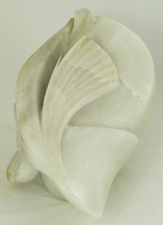 Sculpture in alabaster by West Coast sculptor, Kirk Tatom. Very finely carved piece can be displayed from various angles. Piece also pierced, as indicated in photo two. <br />
<br />
Kirk Tatom has sculpted stone since the early eighties.  He has