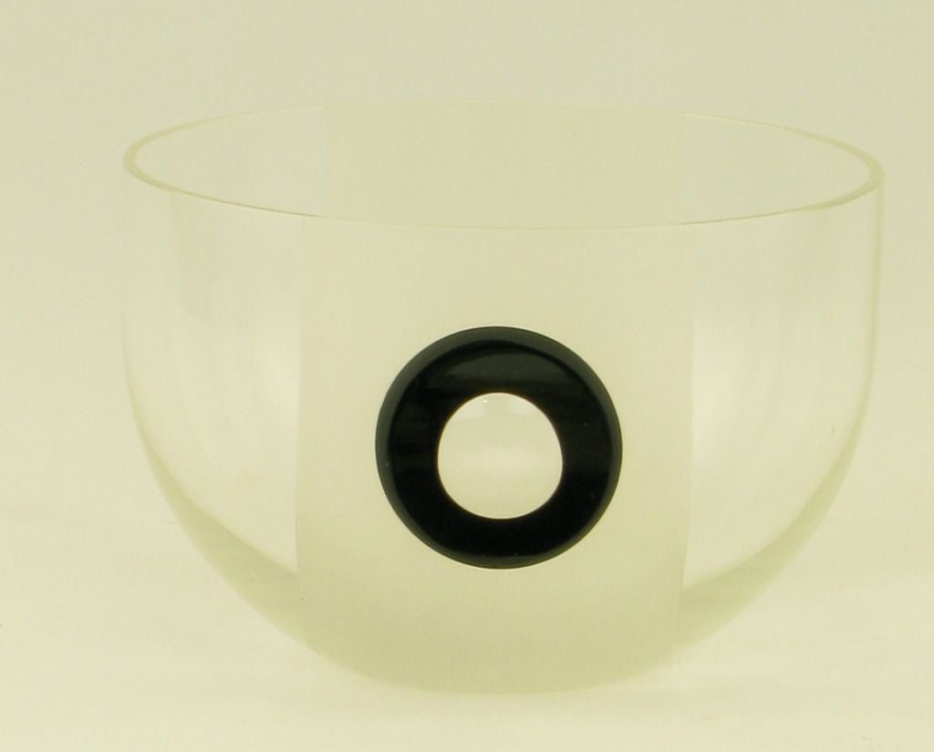 Clear glass bowl with unusual black fused glass circle and elliptical glass center. Finely ground edge; from Rosenthal's Studio Line. Decorative and functional.