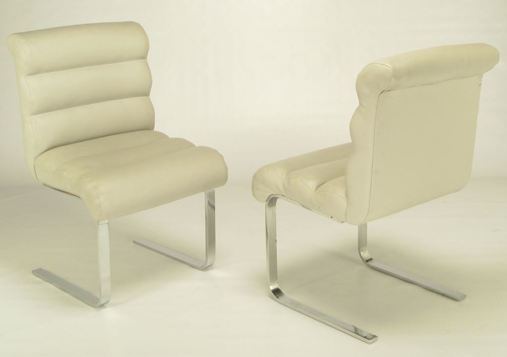 Set Four Chrome Dining Chairs With Rolled Ivory Upholstery