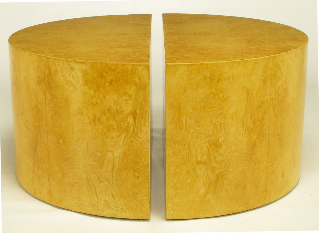 Olive ash burl clad half-circle coffee tables in the manner of Milo Baughman. Can be combined as a single circular coffee table, a pair of demilune coffee tables, as well as a racetrack oval coffee table with the addition of a glass top to span a