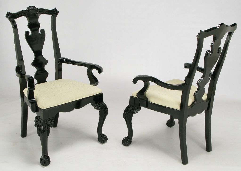 Pair of Chippendale inspired and curvaceous arm chairs by Century Chair Company. Cabriole front legs with foliate detail to the top, grounded by ball and claw feet. <br />
<br />
Influenced by the late 1970s revival of art deco, the