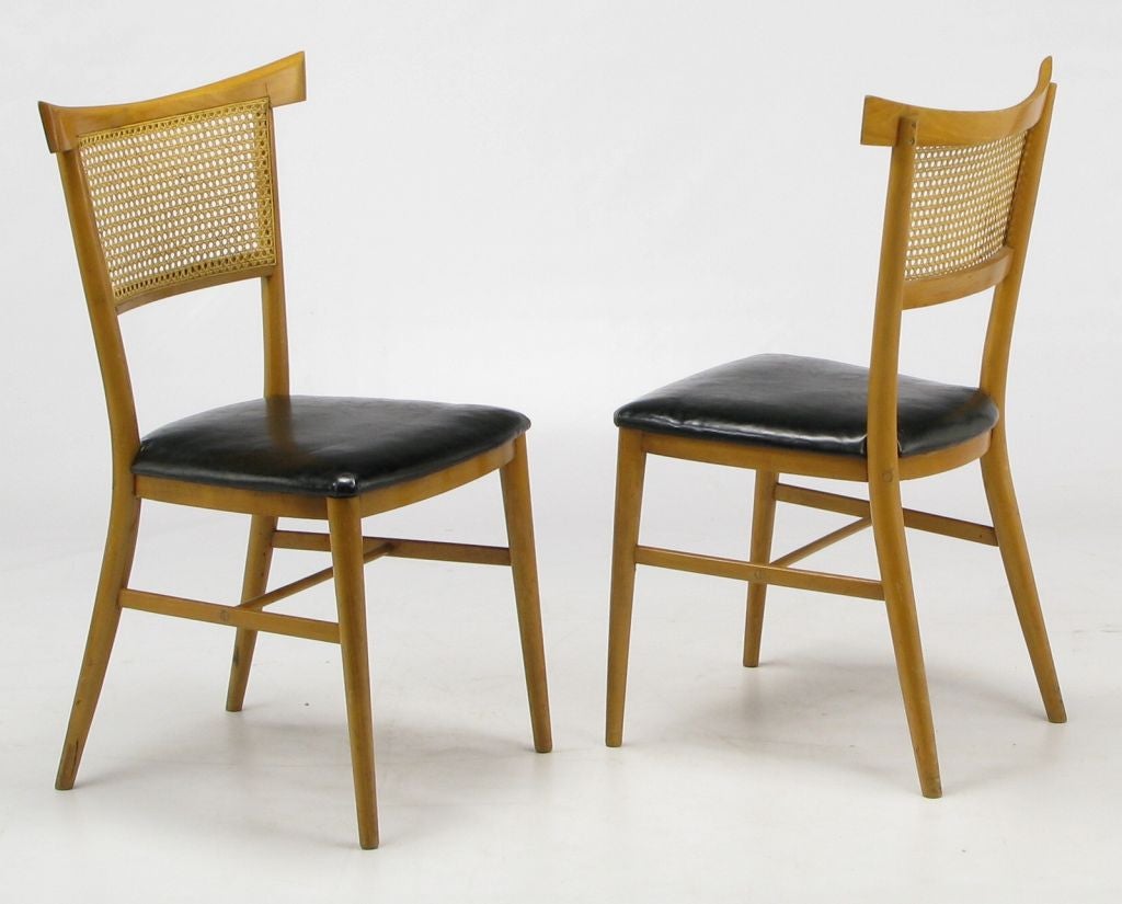 Paul McCobb Perimeter Group maple and cane dining chairs with black vinyl seats. Soft Asian influence with pagoda form chair back. Original in every way.
