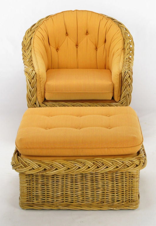 Italian woven and braided rattan barrel back lounge chair and matching ottoman from The Wicker Works of San Francisco, CA. Upholstered in the original button tufted soft striped tangerine cotton blend fabric that is in great shape; only minor even