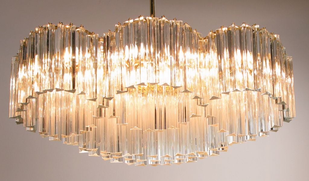 An unusual double helix shape, with eight sockets, this Venini chandelier is brass stem mounted. Clear Murano glass crystals are triangle shaped rods, and attached to follow the open frame.
