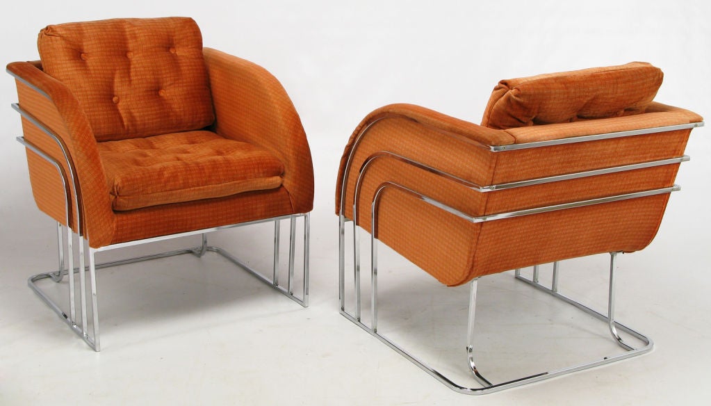 Unique and striking pair of Milo Baughman for Thayer Coggin club chairs in a soft checked persimmon velvet. The loose seat and back cushions are button tufted. The frame is comprised of curved triple chrome bar legs, arms and back with a