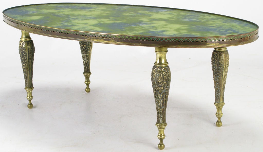 Italian Oval Brass Cocktail Table With Reverse Painted Glass Top