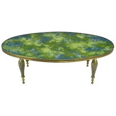 Oval Brass Cocktail Table With Reverse Painted Glass Top