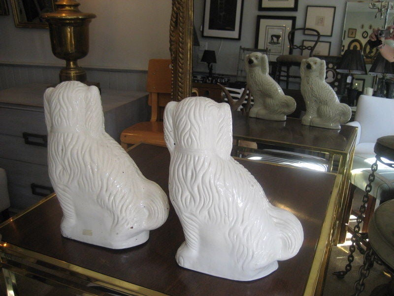 Large pair of white porcelain Staffordshire dogs