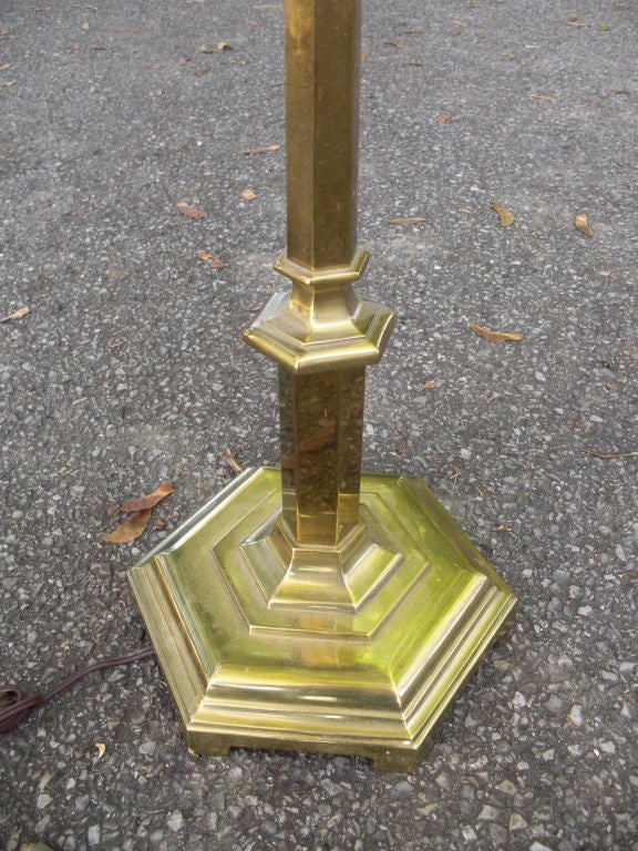 A quality and very heavy vintage brass floor/bridge lamp by the 