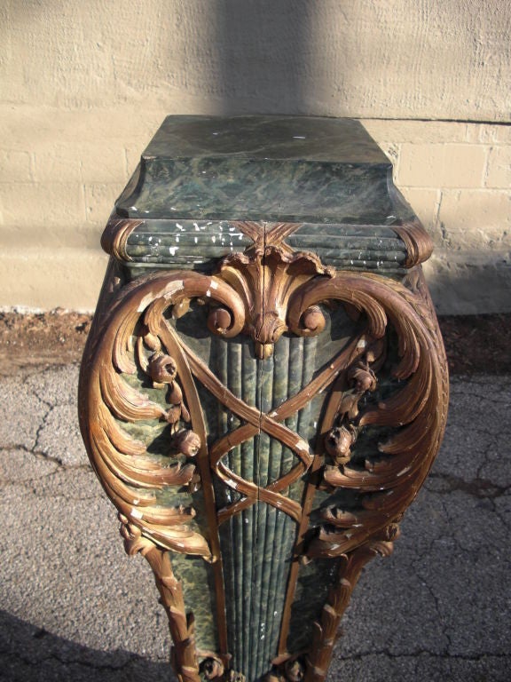 A great late 19th century Roccoco style carved and polychromed wood pedestal faux decorated to look like ormolu mounted green marble. Probably Italian , possibly French and should date to around 1860.