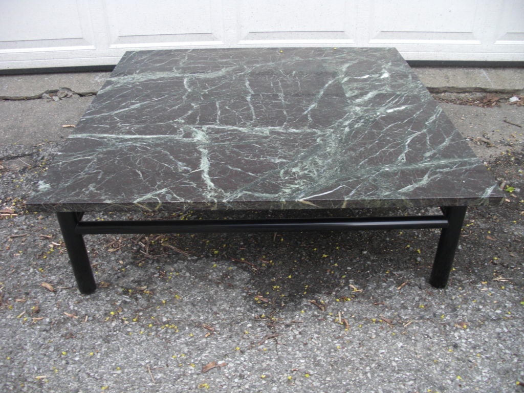 A labeled Widdicomb [ probably designed by Robsjohn Gibbings ] large marble top cocktail / coffee table. We just had it restored in a dark finish to match the beautiful original marble top . The top is a sort of deep brown almost violet color with