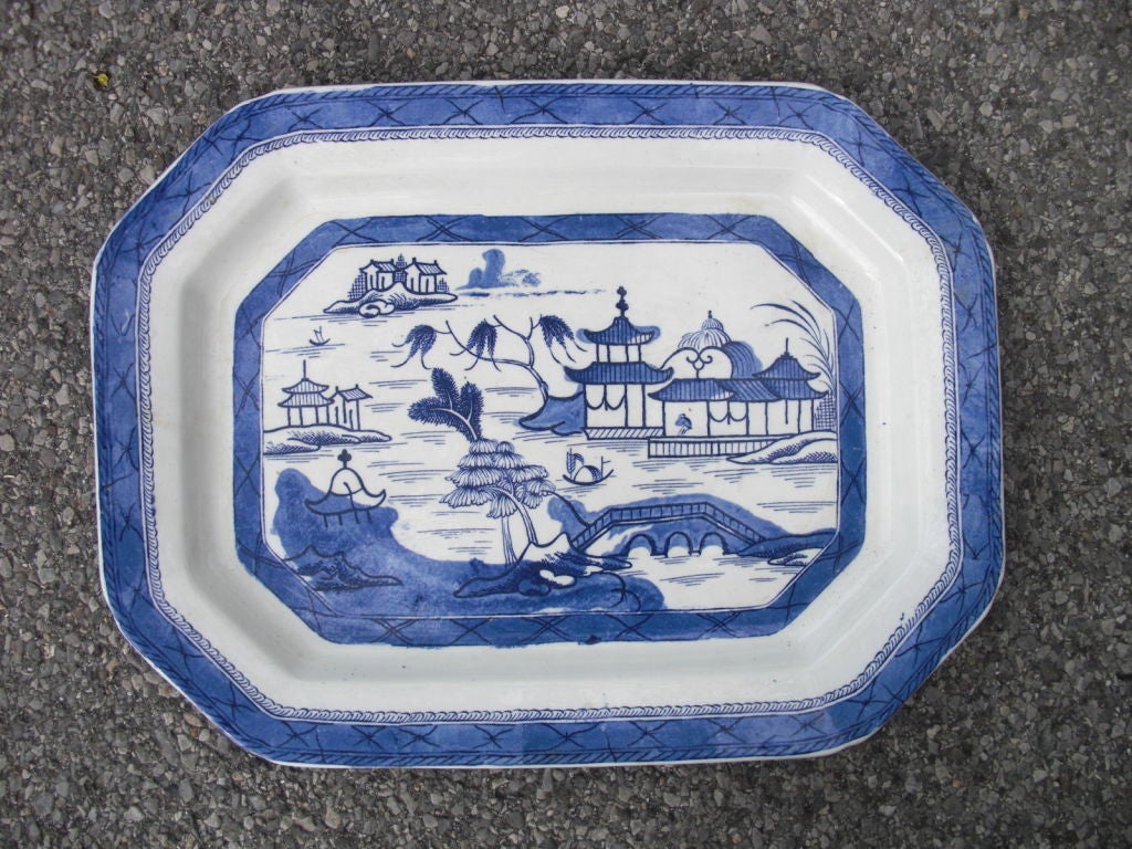 A large English blue and white Octogonal platter copying earlier Chinese canton.Underglaze manufacturers mark that is partially illegible. Perfect to serve on or looks great in a cupboard. Hard to find big ones like this in good condition.