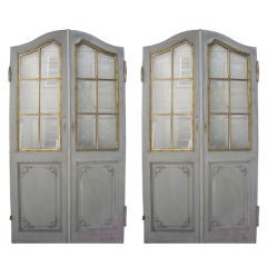 A pair of French bronze mounted and painted doors.