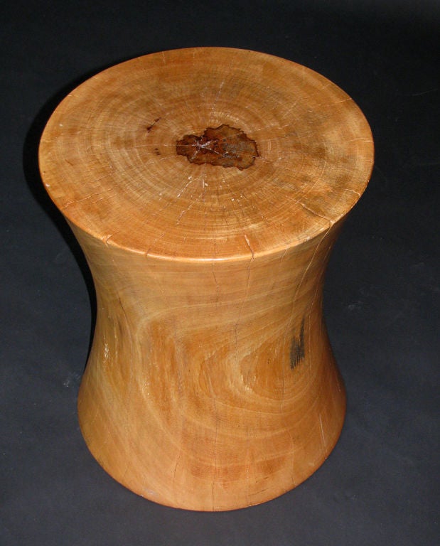A carved red cedar wood table or stool by artist Brent Comber, Vancouver, Canada. <br />
This piece has a wonderful shapely form, carved from a solid trunk of wood.
