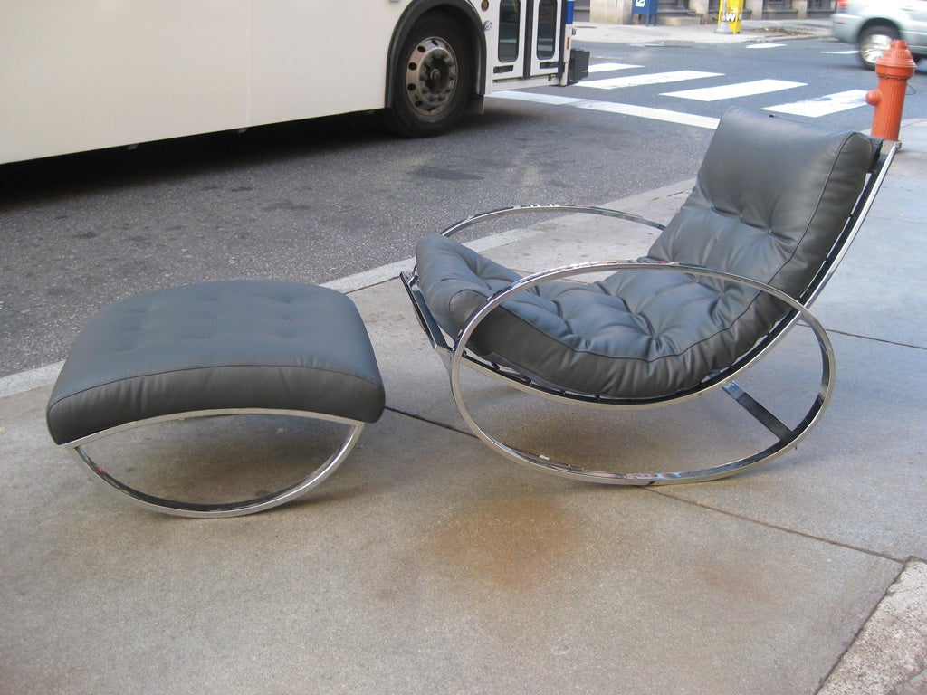 Large chrome and steel Lounging Rocker and ottoman with blue gray leather.  Beautifully redone and ready to go!  Many times attributed to Milo Baughman but in fact designed and manufactured in Italy.