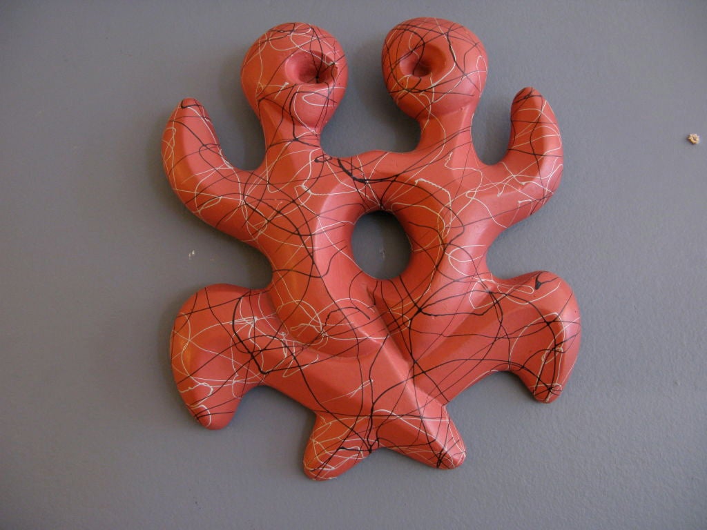 Plaster and hemp image of Gemini figures with original coral paint and black and grey drizzled paint