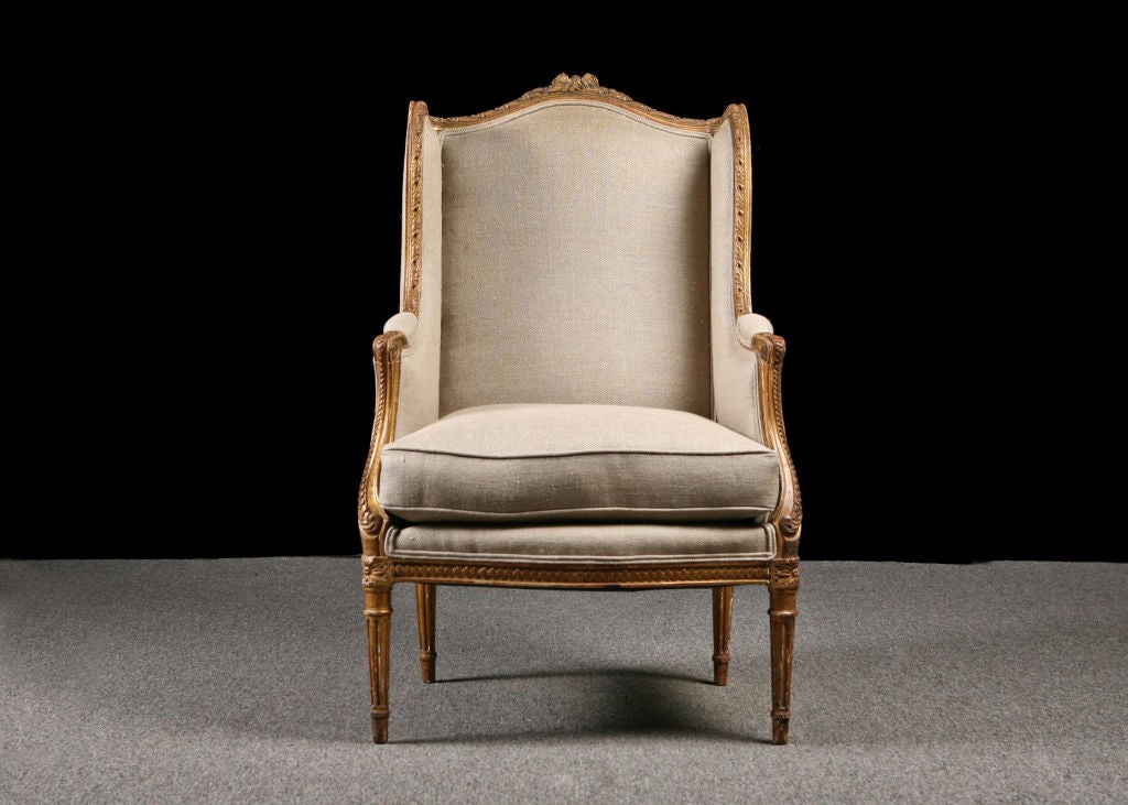 French Antique Giltwood Louis XVI style Winged Bergere, newly upholstered.