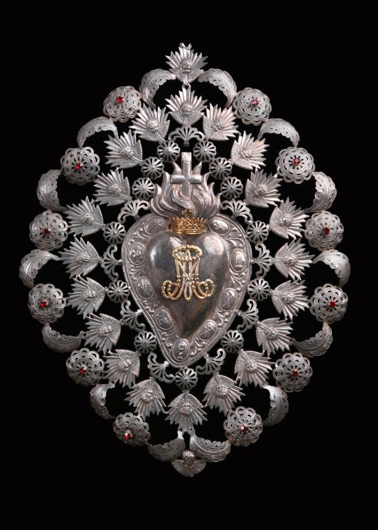Beautiful, and exceptionally large Italian Antique Repousse Silver Ex-voto with Cut Glass Jewels. The centerpiece is the Immaculate Heart of Mary with the Marian symbol letters AM (Ave Maria) in gold. An ex-voto is a votive offering to a saint or