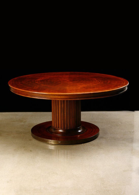 Belgian Art Deco Mahogany Round Table with fluted pedestal and brass band along base. Beautifully matched veneer on top and base of table.