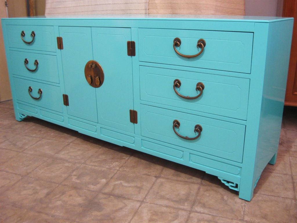 Elegant lacquered ming style with a chinese chippendale feel, style cabinet / sideboard . Wonderful for, large brass hardware, bracket front legs, superb rich soft aqua lacquer finish. Overall Superb.<br />
For additional, consoles, credenzas,