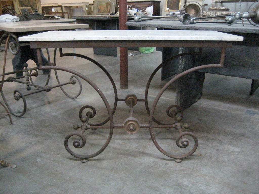 This 19th century butcher's display table features a marble slab top and delicate iron base. Originally used to display butcher's product in a "boucherie," this piece is perfect for a small entryway or kitchen area.