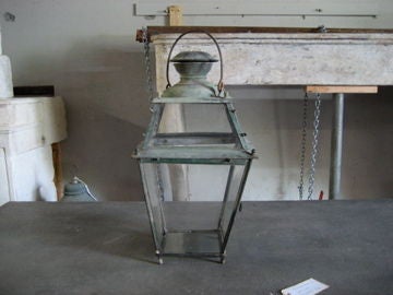 Early 19th c. French lantern.  Round hook at top.  Reclaimed glass newly added.  One panel opens to access interior.