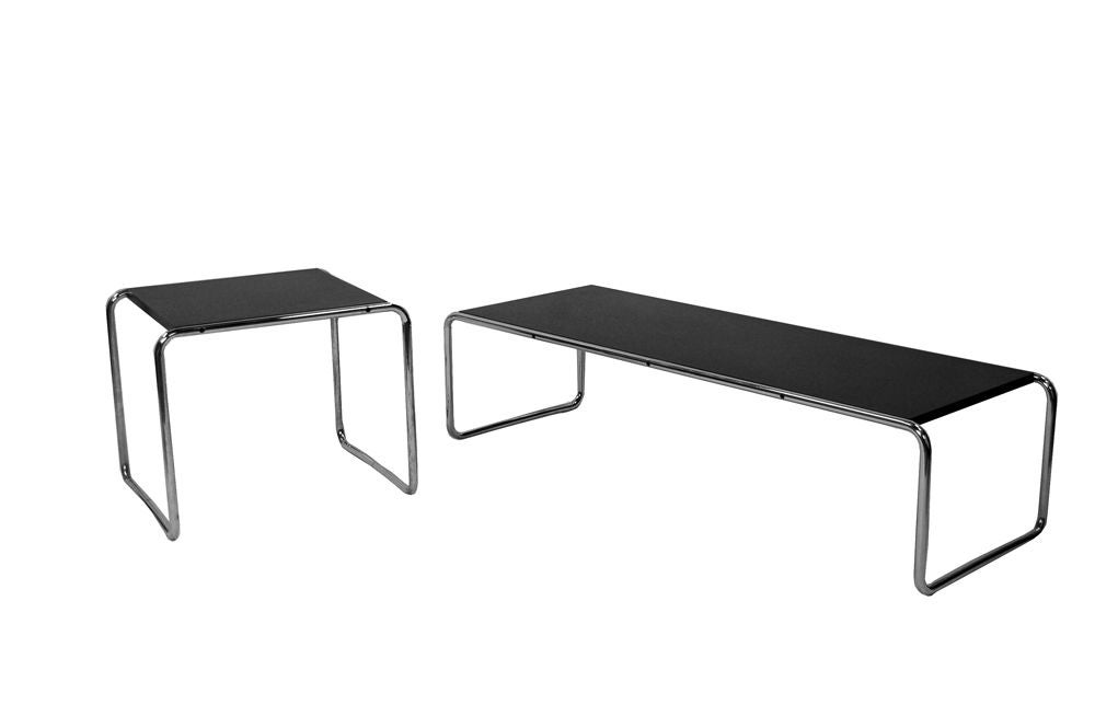 Pair of Marcel Breuer Laccio tables, coffee table interlocks with side table. Black laminate tops on polished chrome frame.<br />
Long table: 53.5