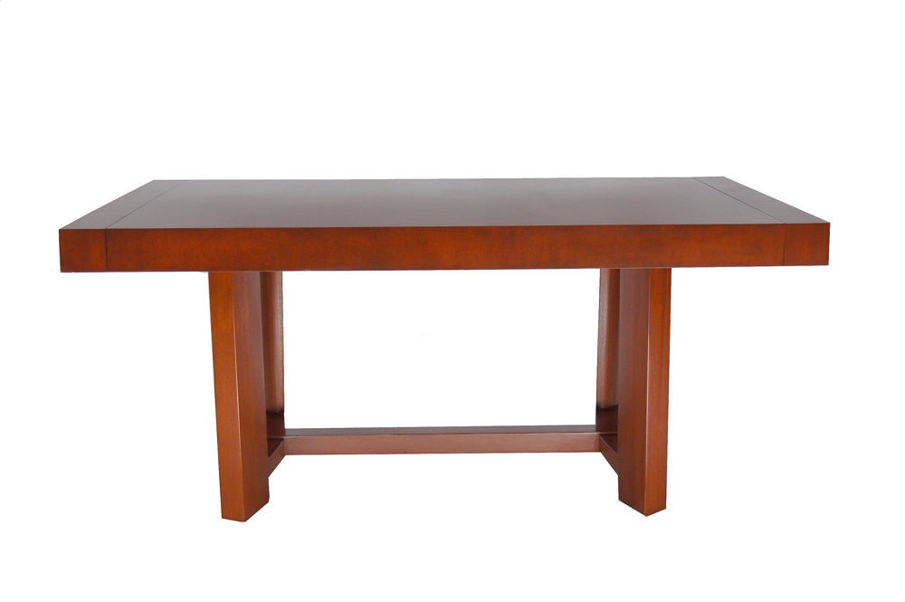 Early Gibbings designed mahogany dining table; leaves are placed into sides of table when extended. Curved support rails between legs. Restored. Total length with leaves 94