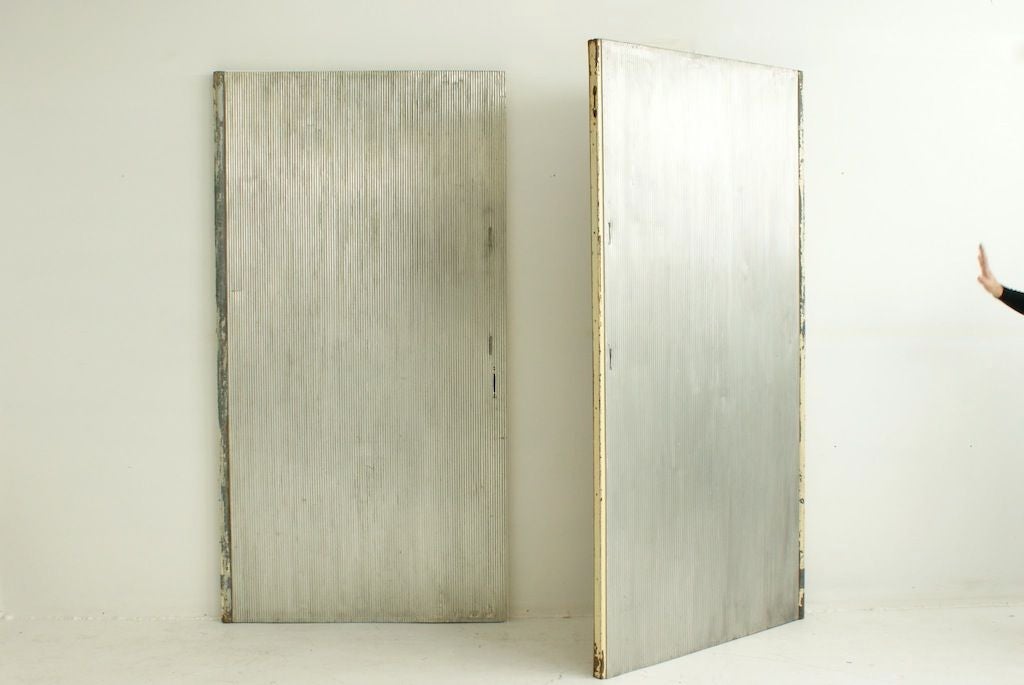 Pair of doors from the Grand Casino, Royan
Ateliers Jean Prouvé
Corrugated and oxidized aluminum sheet, steel, ash
Doors are reversible to reveal wood or metal side.