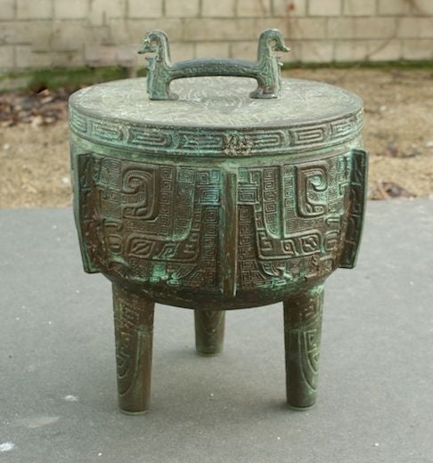 Ice bucket, cast copper with Asian motifs. Purchased at GUMPS department store San Francisco.