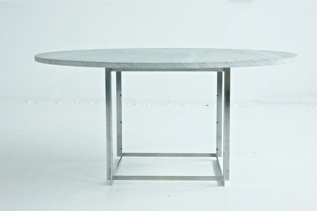PK 54 dining table<br />
E. Kold Christensen<br />
Denmark, 1963<br />
flint-rolled Cippolino marble, matte chrome-plated steel<br />
55 dia x 27 h inches<br />
Signed with impressed manufacturer’s mark to base.
