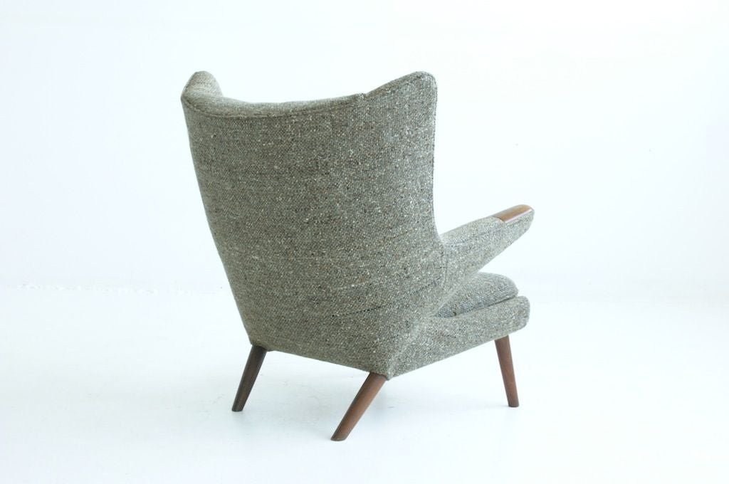 HANS WEGNER, Papa Bear chair<br />
circa 1965<br />
upholstery, teak<br />
<br />
Signed, stamped to underside: Made in Denmark, Designer: Hans J. Wegner A.P. Stolen.