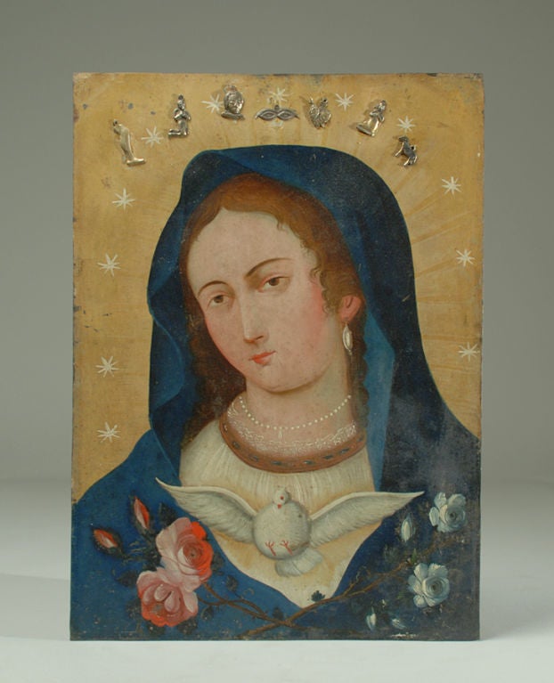 A good, large 19th century 'Alma de Maria' retablo painting on heavy gauge tin. In this classic image Mary is surrounded by an aura of radiant light with old silver milagros and twelve stars encircling overhead. In the foreground, the 