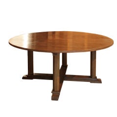 An oak Dining Table in the Arts and Crafts manner