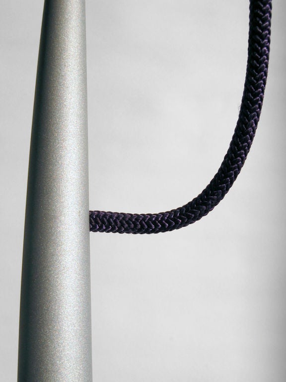 Textured silver steel hanging pendant lamp with purple braided nylon cord, designed by Philippe Starck for the Paramount Hotel in New York City. This lamp was exclusive to the Paramount Hotel, and was never in production.