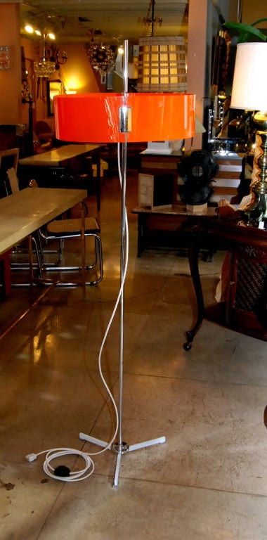 Italian tall adjustable floor lamp with orange acrylic shade.
Three lights.