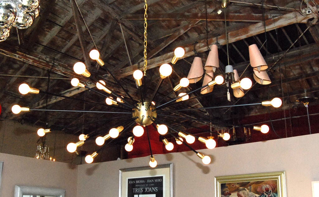 Large thirty-six-light satin brass and black enamel finish Sputnik chandelier.