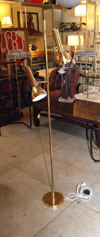 Italian brass floor lamp with two-light articuled.